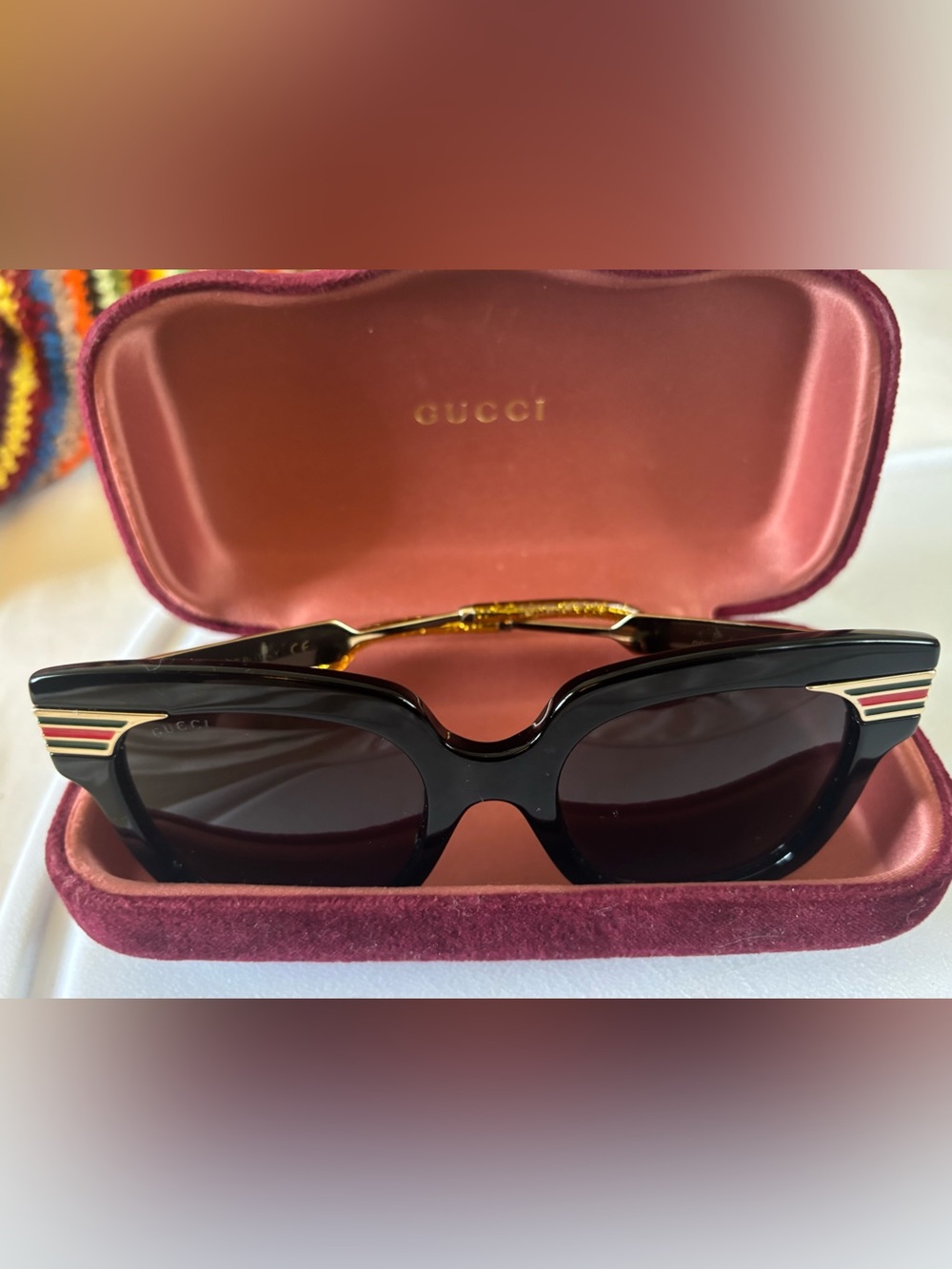 Gucci GG0281S Black Sunglasses with Red & Green Temple Stripes.